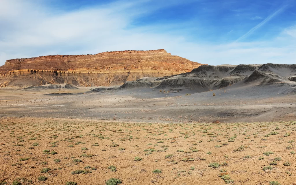 Desert Rocky Terrain Sparse Vegetation Blue Sky
