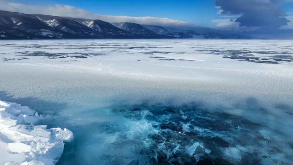 Frozen Lake Ice Crystals Mountains Snow Clouds