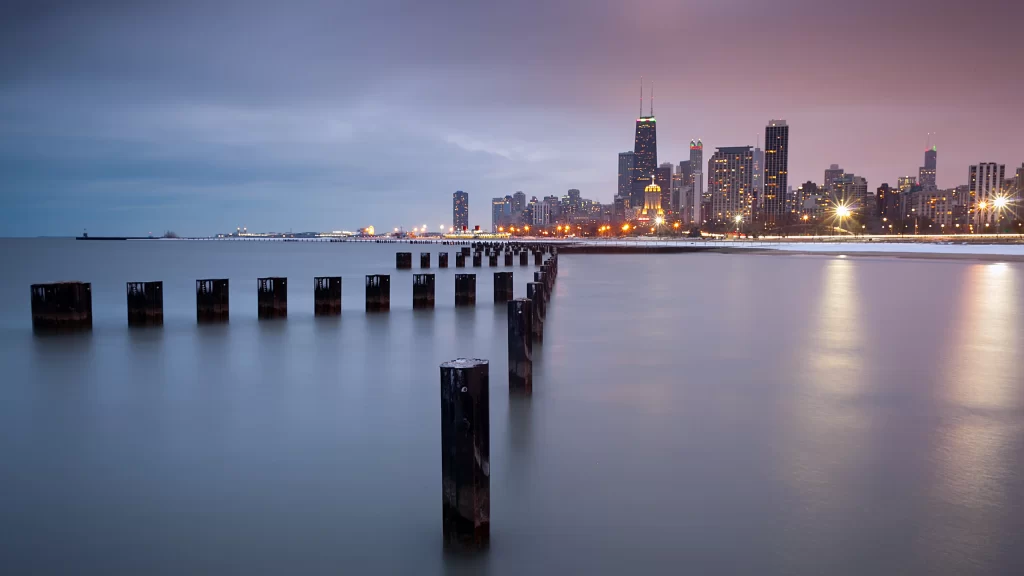 City skyline waterfront dusk calm reflections urban lights