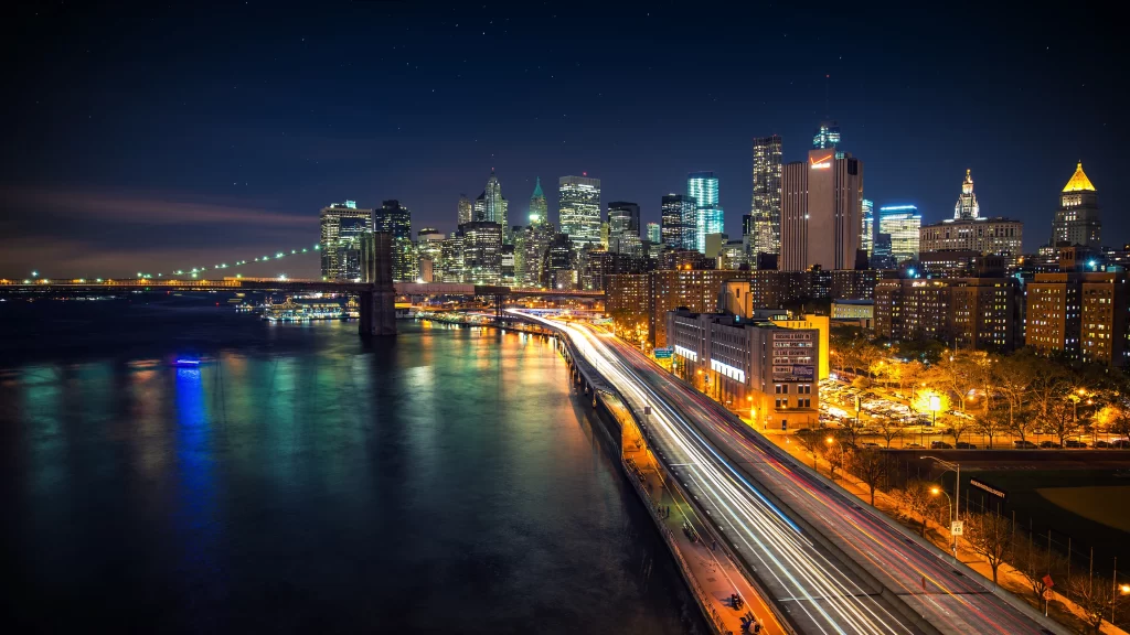 Cityscape night lights bridge water skyline