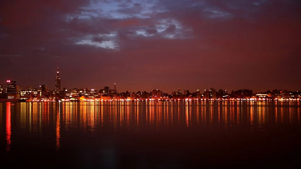 Cityscape night lights reflection water skyline