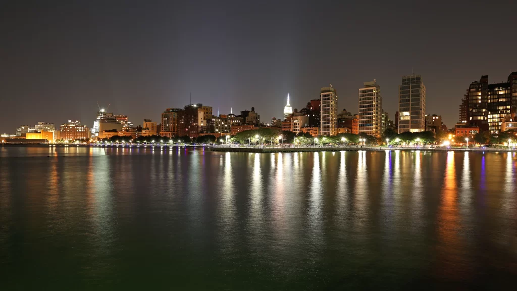 Cityscape night water reflections lights buildings