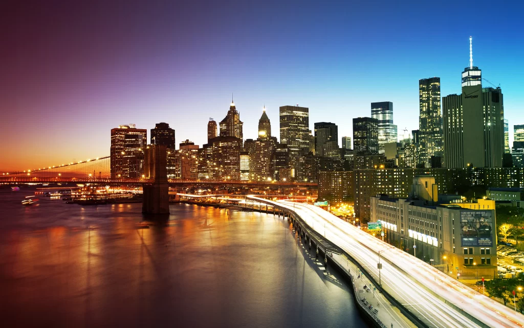 Cityscape skyline bridge water sunset lights buildings urban