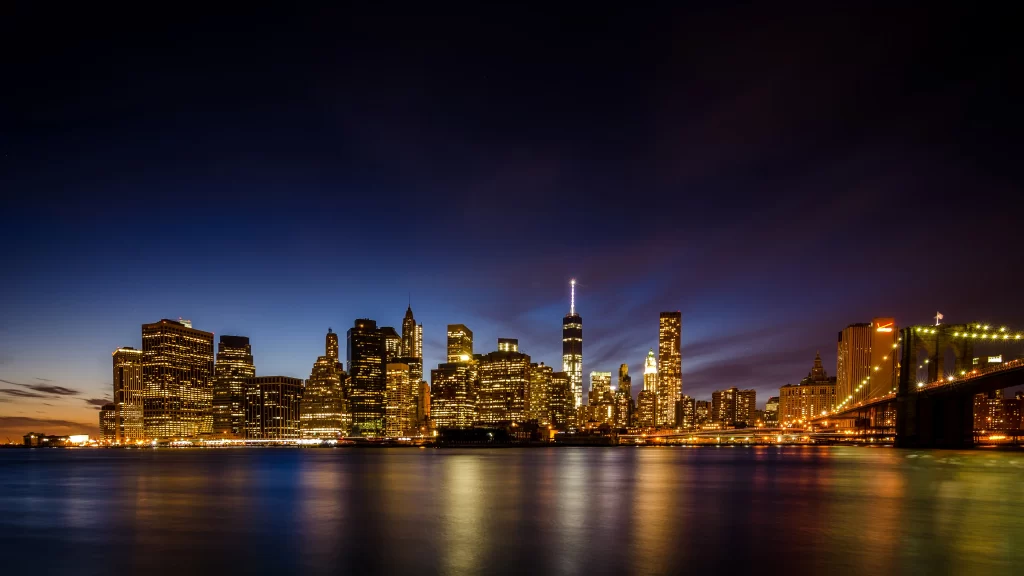 Cityscape skyline twilight bridge water lights buildings reflections