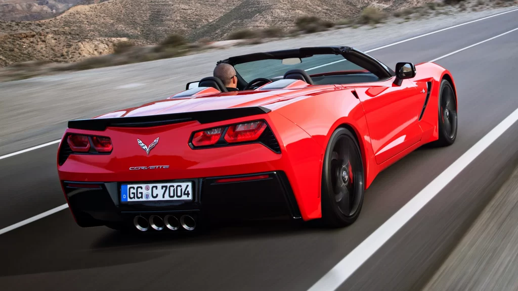 Corvette convertible red road license plate driving