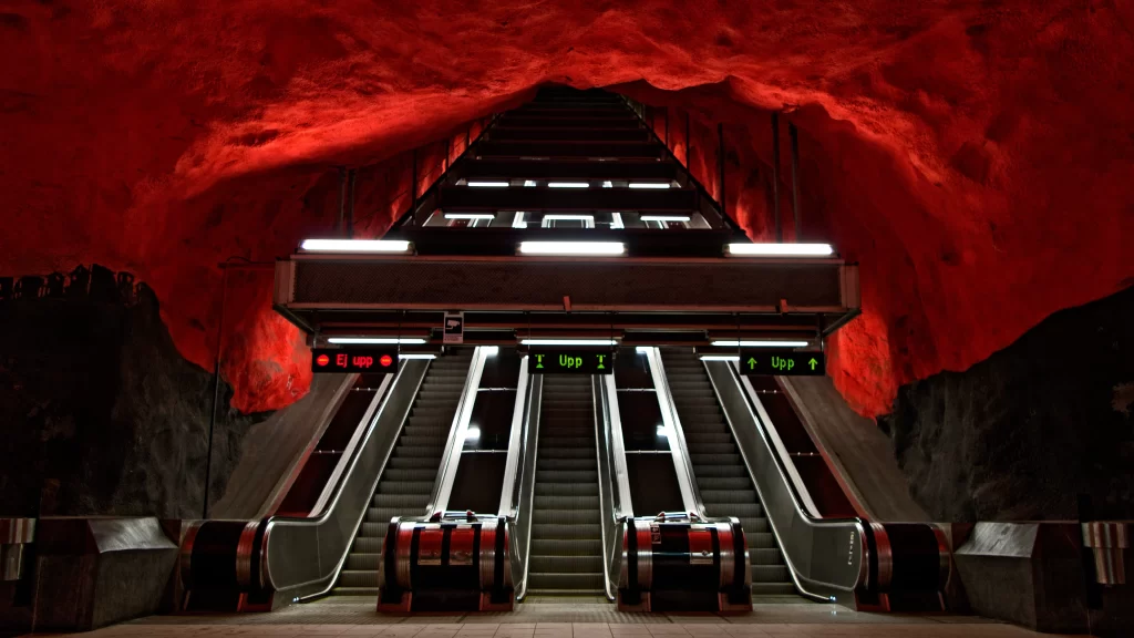 Escalator underground red lighting modern architecture urban