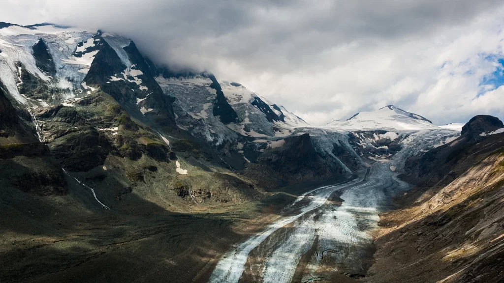 Glacier mountains snow clouds valley landscape