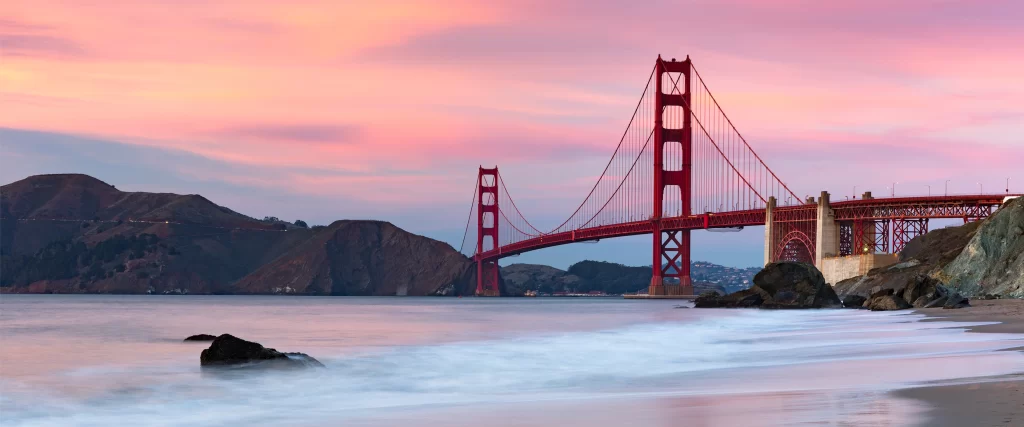 Golden Gate Bridge, sunset, ocean, waves, rocks, pink sky