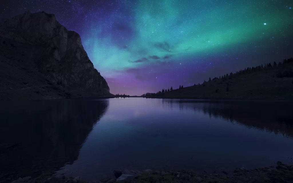 Northern lights lake reflection night stars mountains sky colors