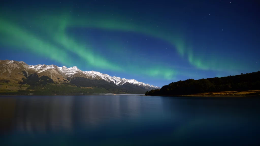 Northern lights mountains lake night reflection sky stars nature