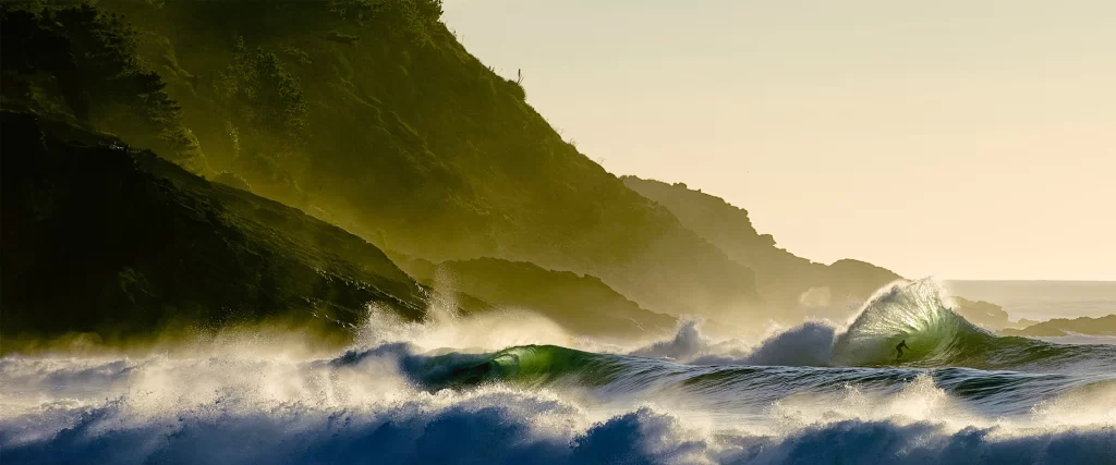 Ocean waves, rocky shore, sunset, surfer, nature, tranquility