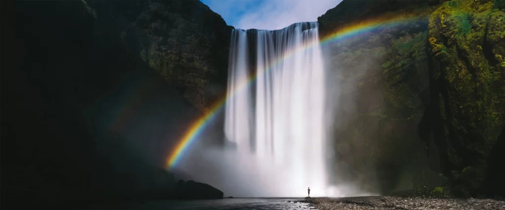 Rainbow waterfall nature mist serene