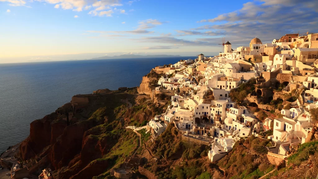 Santorini cliffside sea sunset architecture blue domes