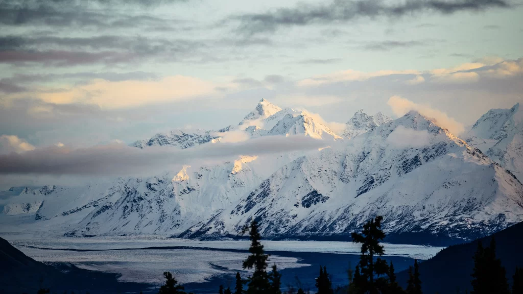 Snowy Mountain Peaks Clouds Sunlight Glacial River