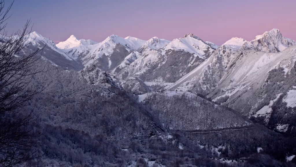 Snowy mountains sunrise pink sky tranquil winter landscape serene nature