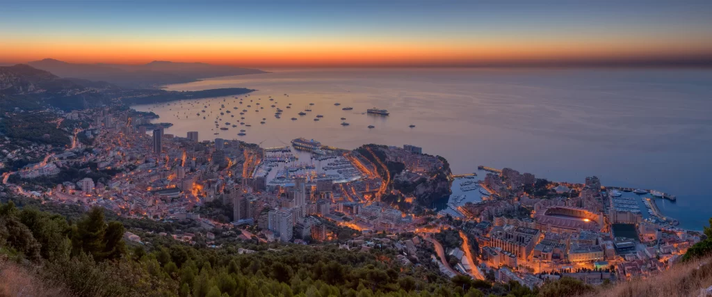 Sunset, cityscape, coastline, boats, buildings, ocean
