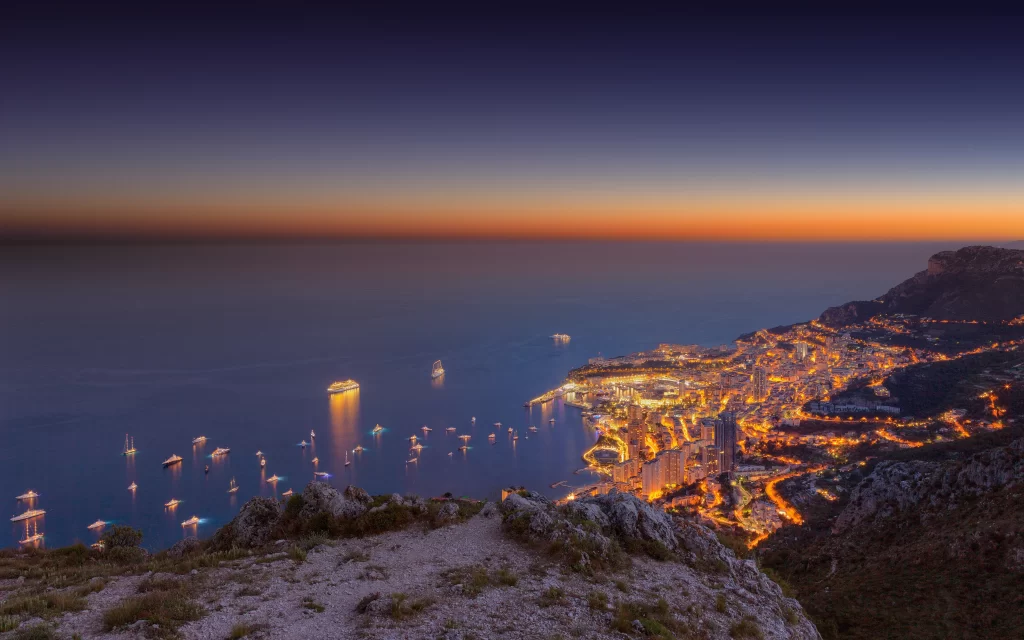 Sunset cityscape ocean lights coastline twilight