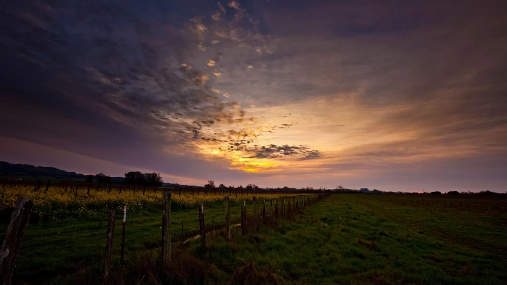 Sunset clouds field fence landscape sky