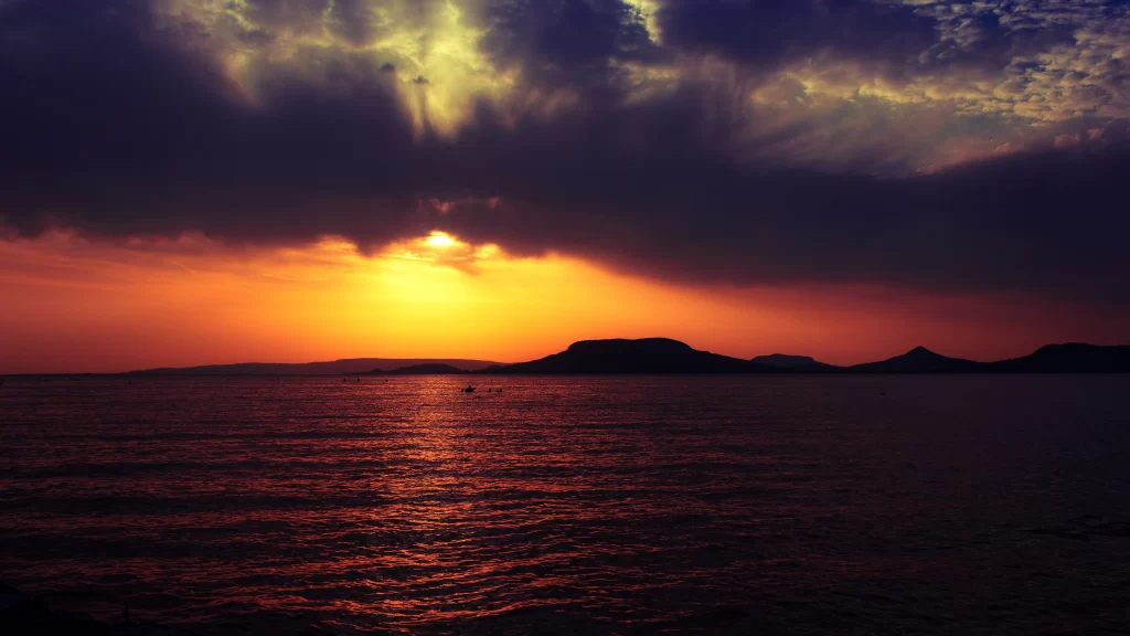 Sunset clouds ocean horizon reflection colors