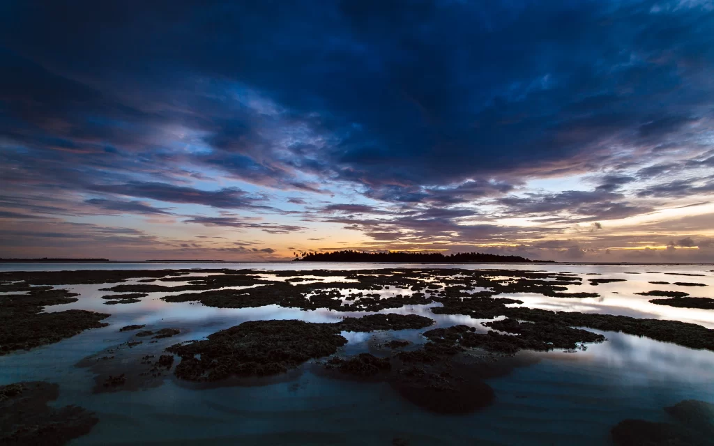 Sunset clouds ocean island reflection sky