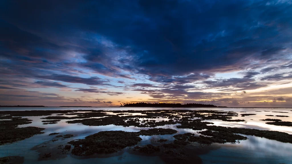 Sunset clouds ocean island reflection tranquil