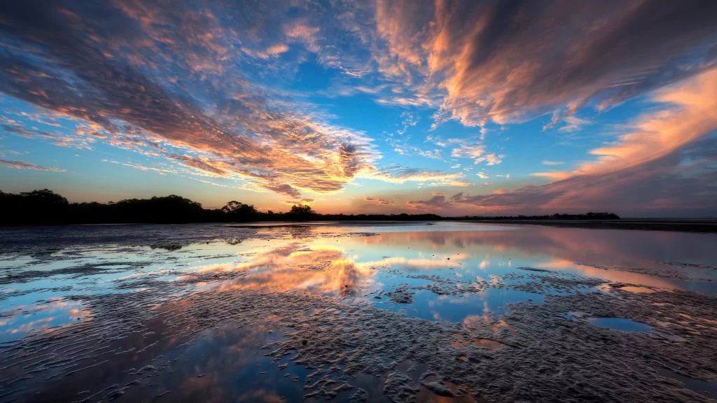 Sunset clouds reflection water sky landscape colors tranquility