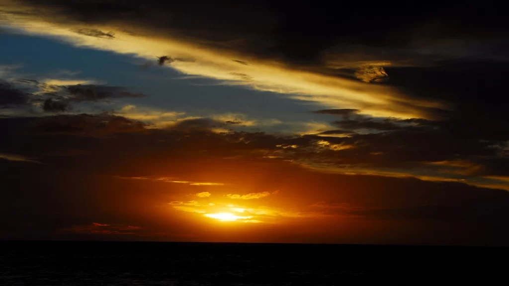 Sunset clouds sky ocean horizon colors tranquil beauty