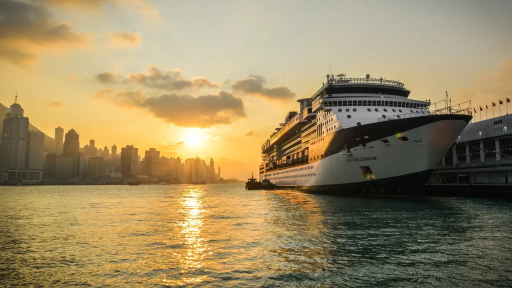 Sunset cruise ship cityscape water skyline harbor reflection travel