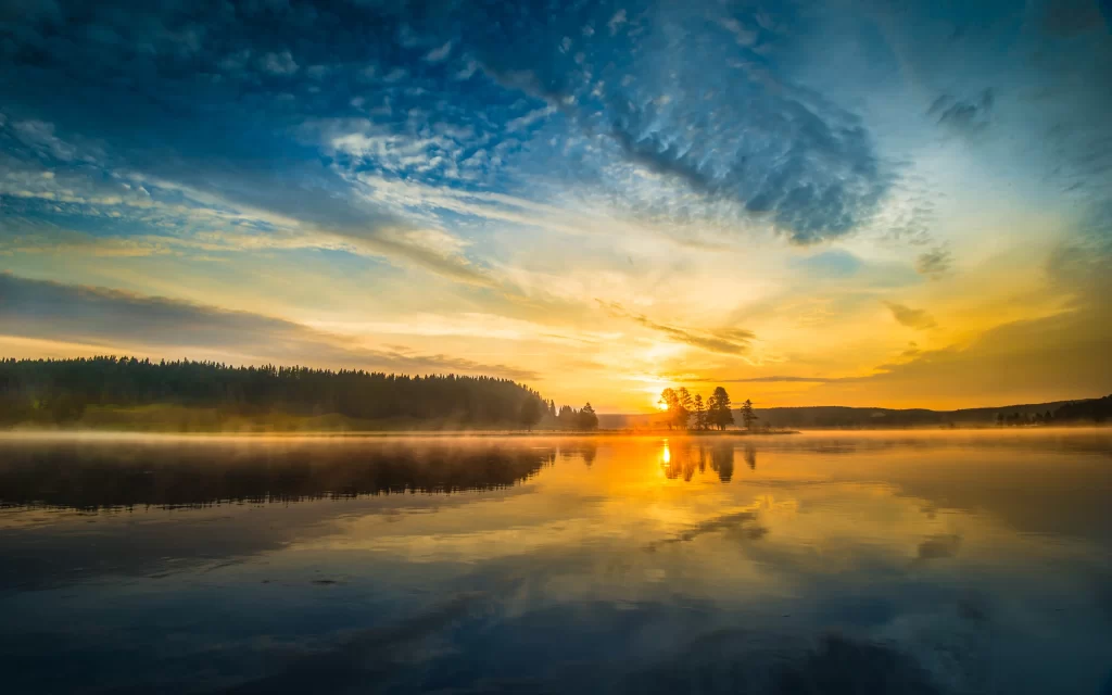 Sunset lake reflection clouds trees mist