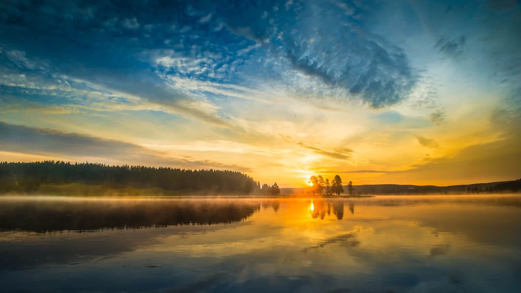Sunset lake reflection clouds trees mist