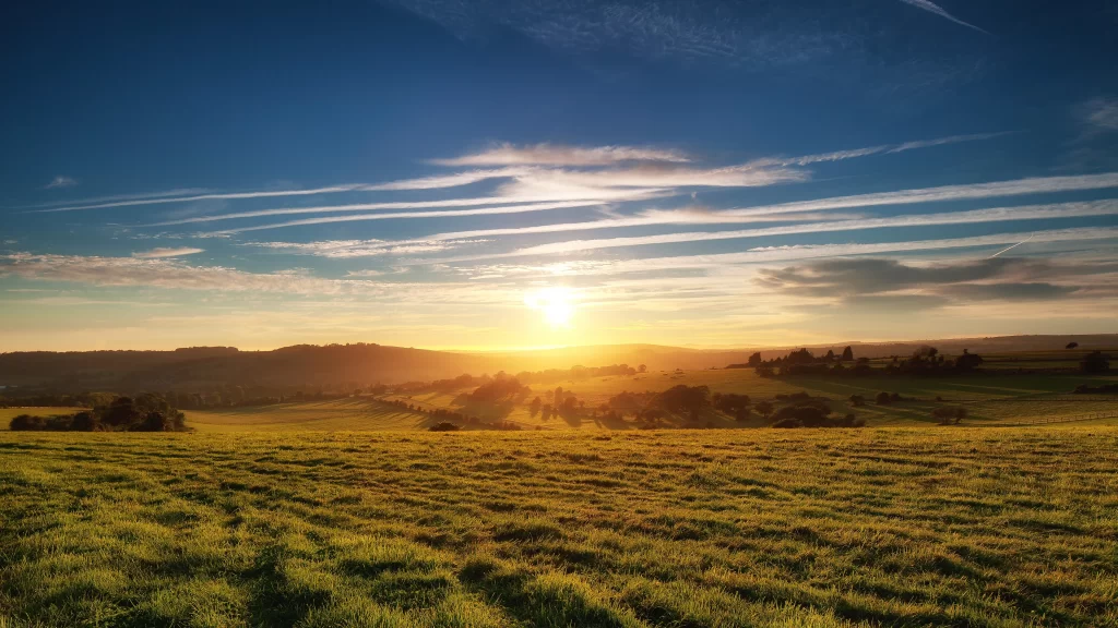 Sunset landscape field sky clouds tranquility