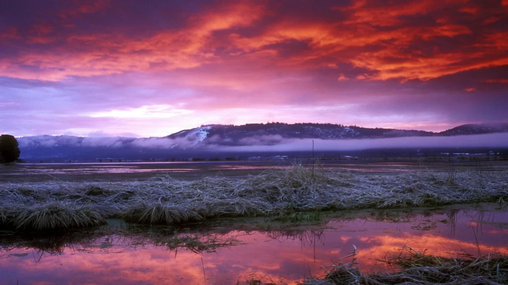 Sunset landscape reflection clouds mountains water