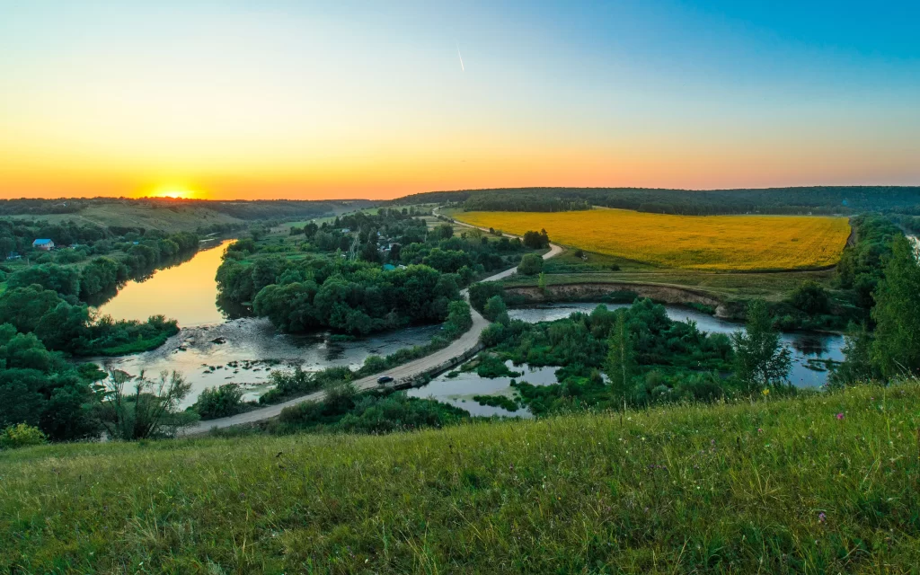 Sunset landscape river trees fields sky