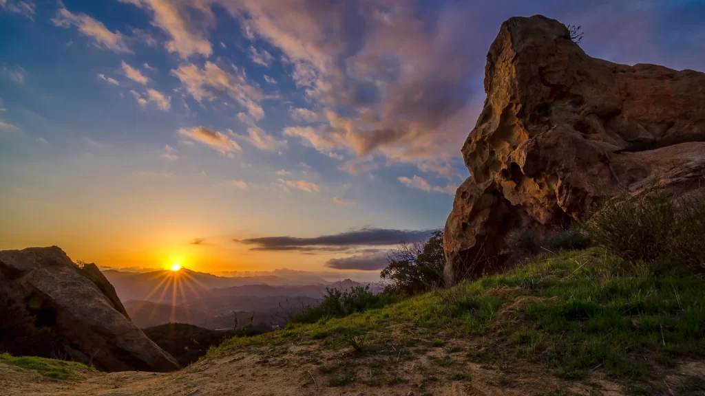 Sunset landscape rock formations clouds nature tranquility