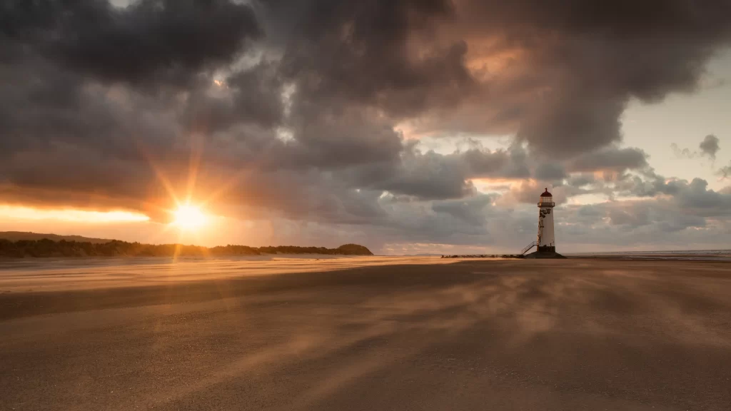 Sunset lighthouse beach clouds horizon tranquil
