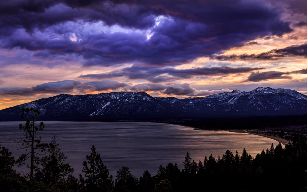 Sunset mountains lake clouds trees landscape