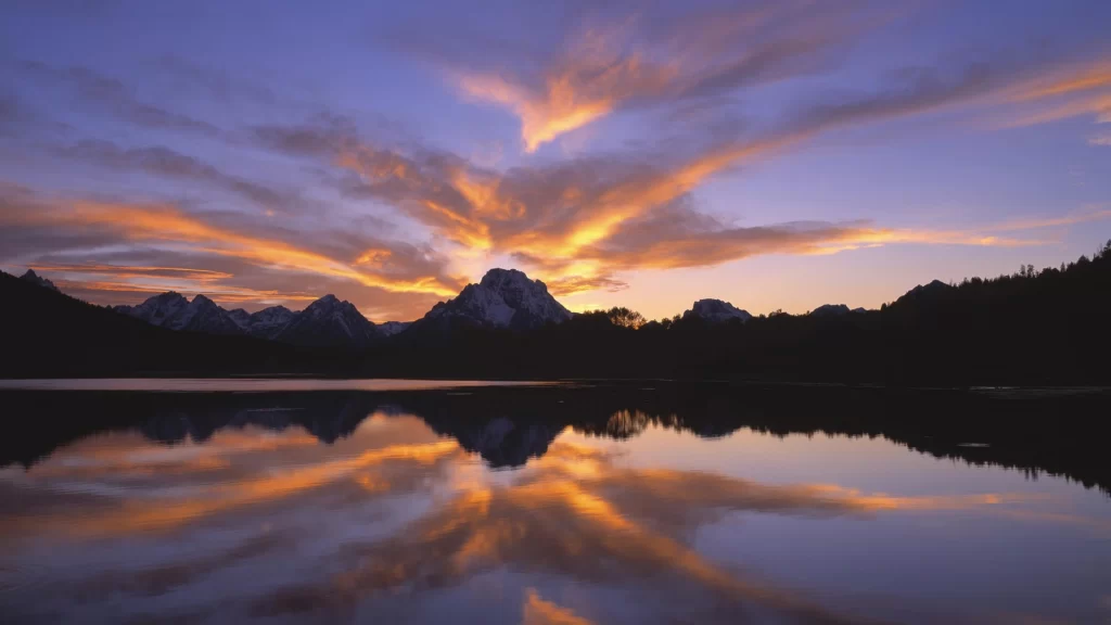 Sunset mountains lake reflection clouds colors