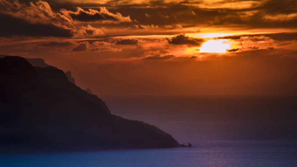 Sunset ocean clouds mountain horizon tranquil