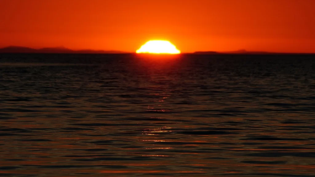 Sunset ocean horizon sky reflection tranquility