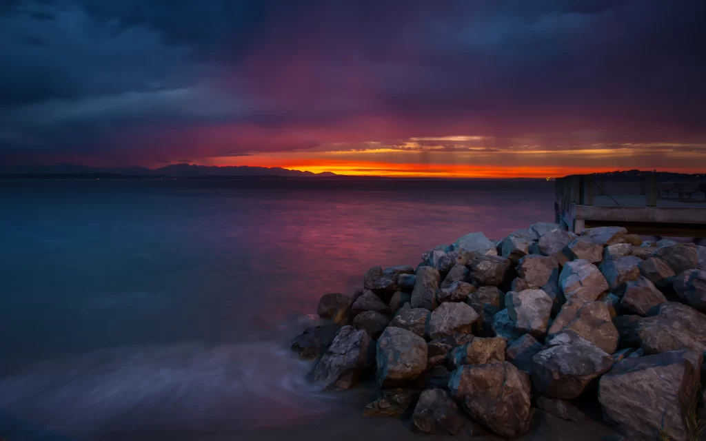 Sunset ocean rocks clouds horizon colors