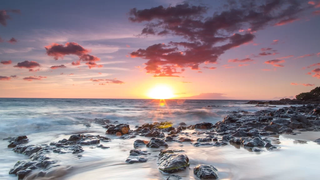 Sunset ocean rocks clouds horizon waves