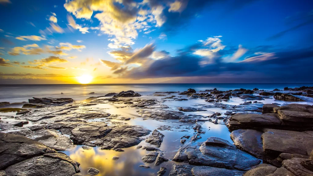 Sunset ocean rocks clouds reflection horizon