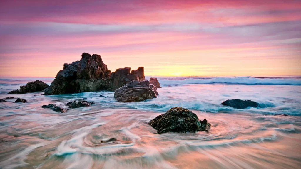 Sunset ocean rocks waves sky colors