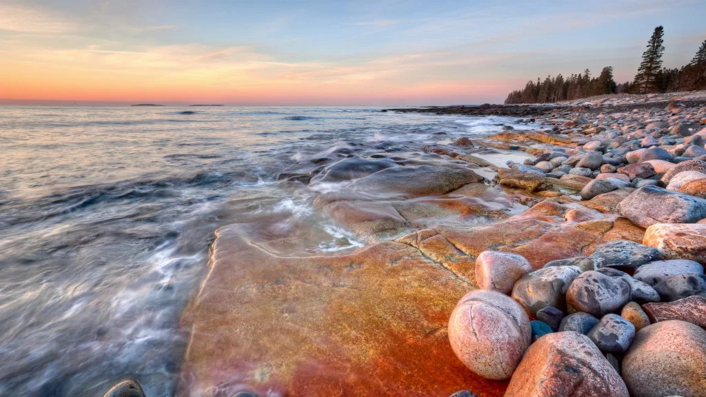 Sunset ocean rocks waves sky horizon