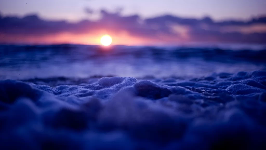 Sunset ocean waves sky clouds horizon