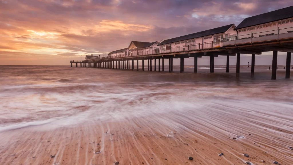 Sunset pier ocean clouds beach waves