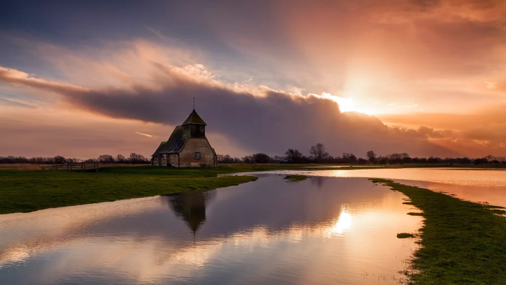 Sunset reflection church water clouds landscape