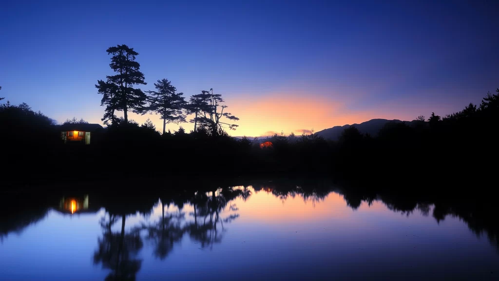 Sunset reflection lake trees mountains sky