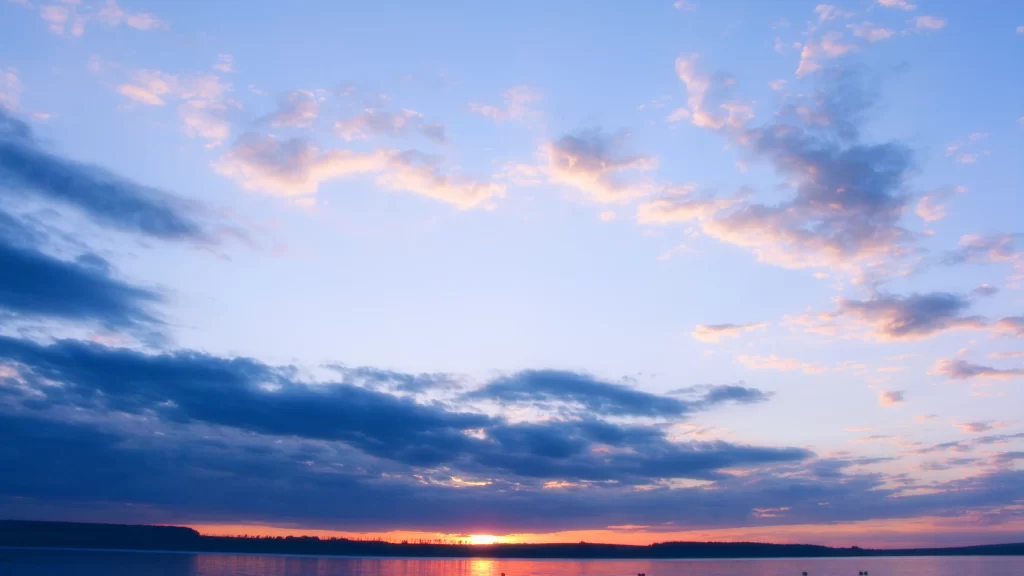 Sunset sky clouds water horizon reflection
