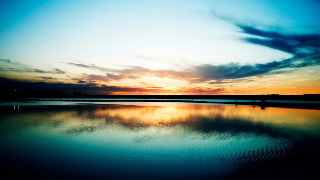 Sunset sky clouds water reflection horizon